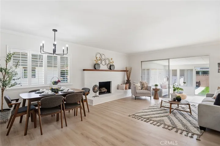 Open Floorplan with Spacious Living Room and Dining Area featuring fresh interior paint and luxury wide-plank vinyl-wood flooring.  Nearly 1,200 square feet of living space - Plus a spacious enclosed patio adding around 170 square feet for a spacious family room (over 1,340 square feet of combined interior space).  Situated on a spacious 6,490 square foot lot,