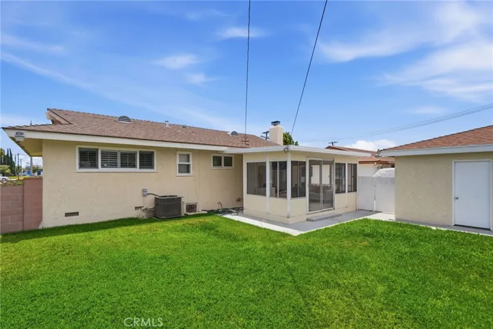 Outside, enjoy the large private backyard and detached two-car garage