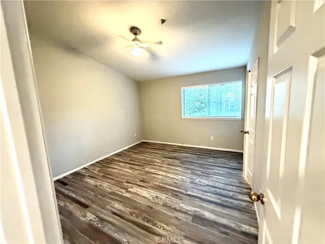 Primary Bedroom has ceiling fan, and double doors into Primary Bath
