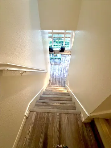 stairway down view into entry living room