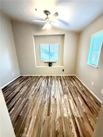 Bedroom 3 has two windows and ceiling fan and closet with door