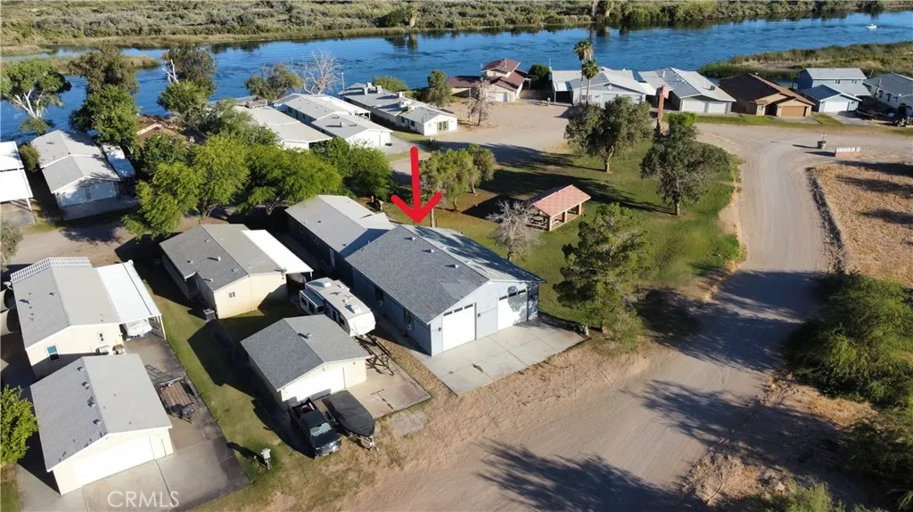 Aerial view of the house in proximity to the water