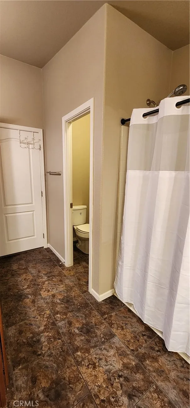 Primary bathroom has tub/shower combo