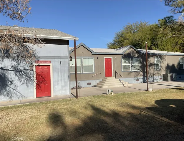Front of the house and pedestrian door into the garage