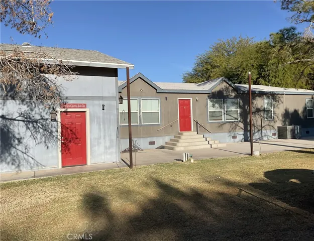 Front of the house and pedestrian door into the garage