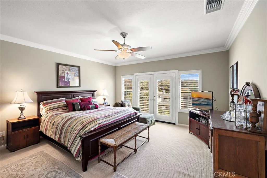 Primary Bedroom with Ensuite Bath and Balcony