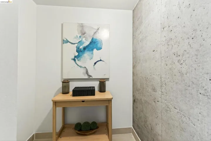 Accent wall featuring a concrete finish
