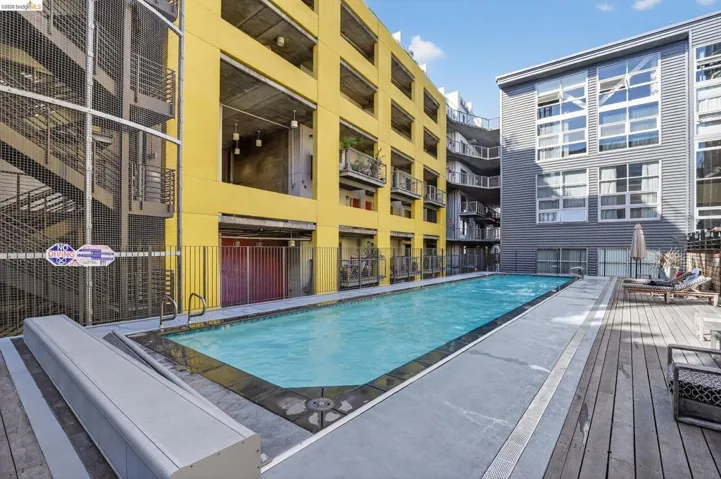 Outdoor swimming pool featuring a rectangular shape and integrated steps