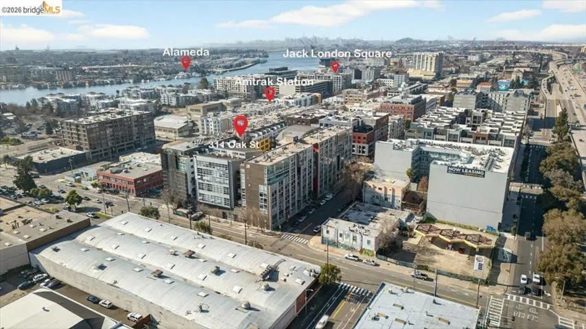 Urban landscape featuring multiple buildings, roadways, and waterfront