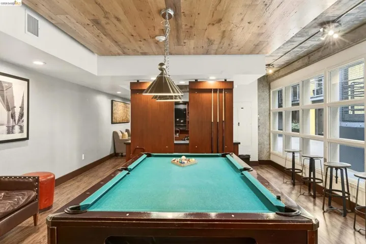 Recreation room featuring a pool table with overhead pendant lighting