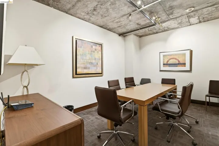 Exposed concrete ceiling with track lighting fixtures
