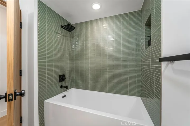 Guest bath with oversized 32” Wide by 66” long acrylic soaking tub
