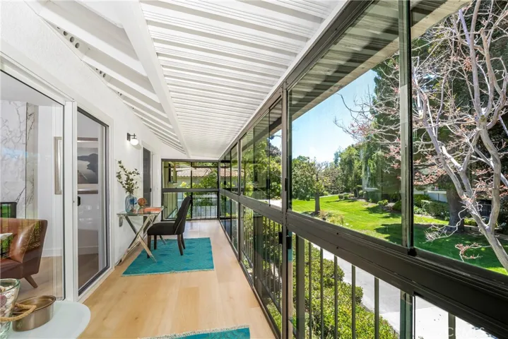 Enclosed patio with view, windows, patio door, & screens