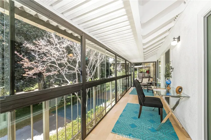 Enclosed patio with view, windows, patio door, & screens
