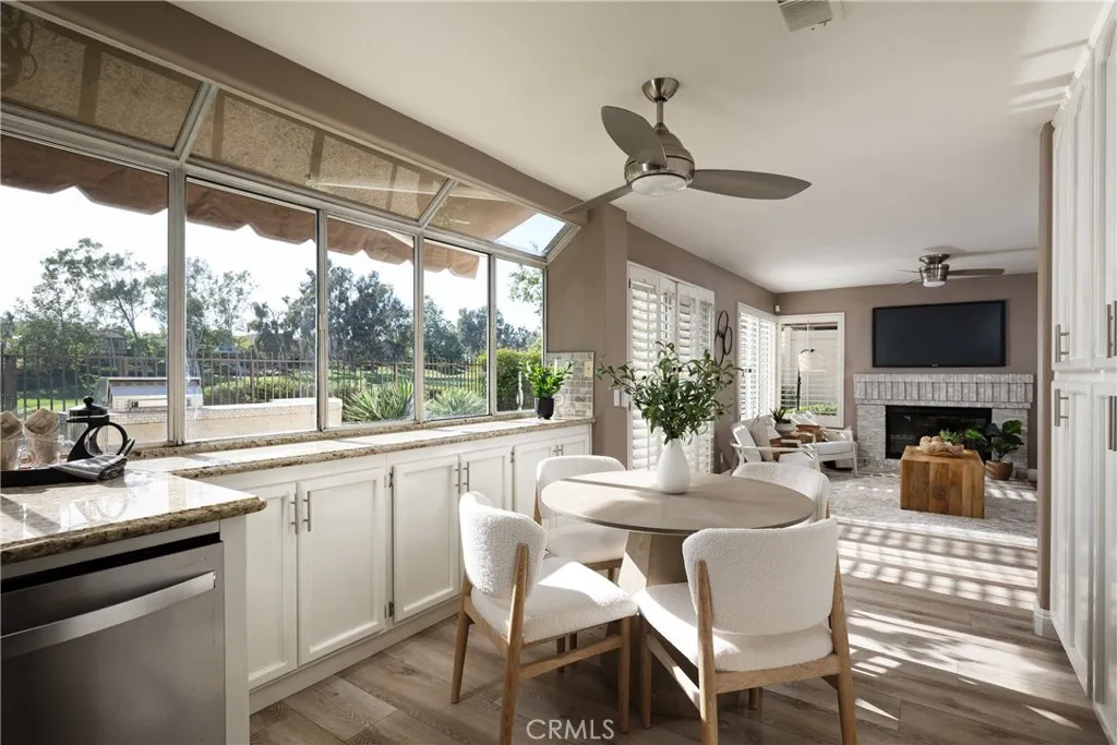 The kitchen features an awning, a sunny breakfast nook, and a gorgeous view of Tijeras Creek Golf Course.