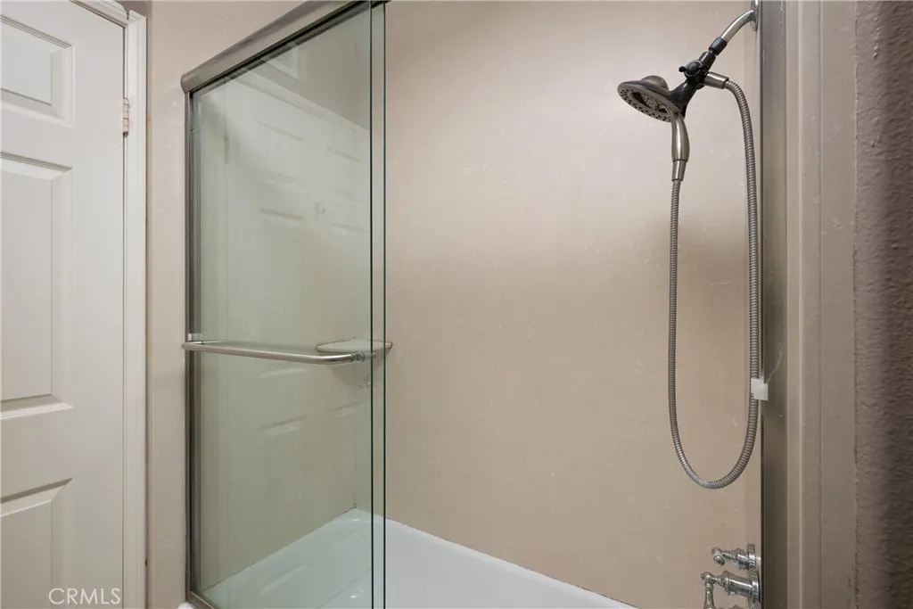 There is a shower in the guest bathroom located upstairs.