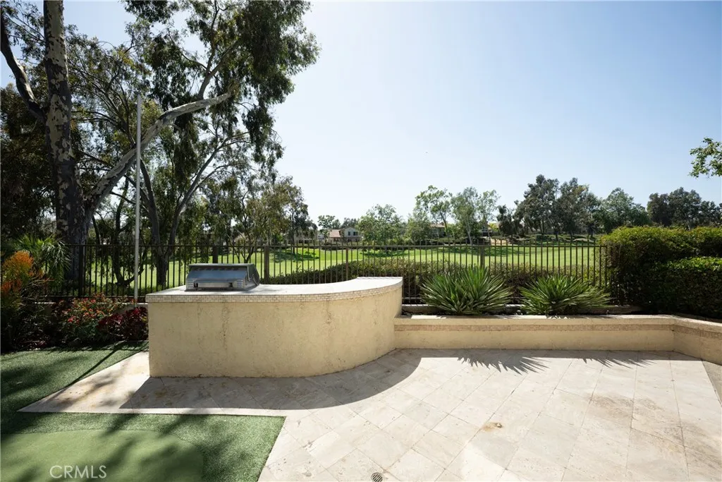 Relax in the backyard, your own private retreat right on the fairway.