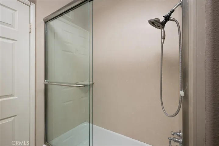 There is a shower in the guest bathroom located upstairs.