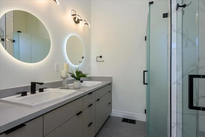 Primary BA w/Beautiful Shower, Dble Sinks, Custom lighting & Privacy Door to Watercloset