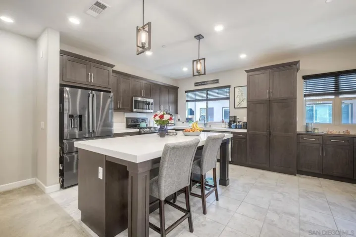 Spacious kitchen with large center island and SS appliainces