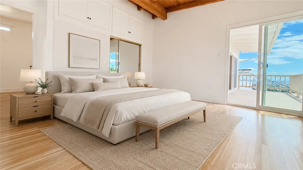 Primary Bedroom — Virtually staged to show possible bedroom layout and scale. Furniture and decor are not included. Original unstaged photo shown adjacent.