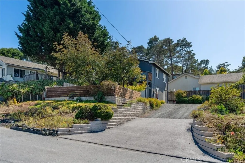 View showing driveway and house (there is a gate at top of driveway).