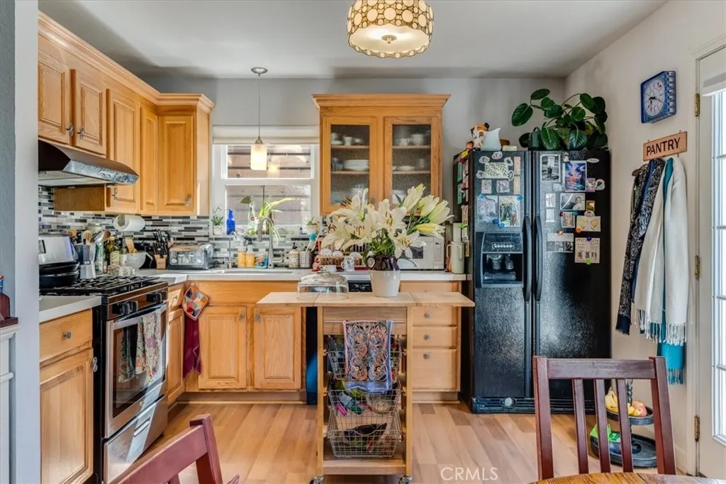 Kitchen view. Larger butcher block and stools will be left with the house. (this is tenants).