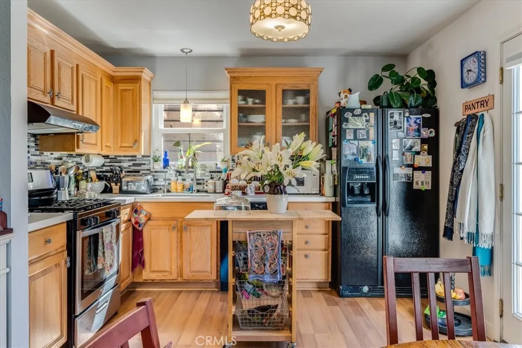 Kitchen view. Larger butcher block and stools will be left with the house. (this is tenants).