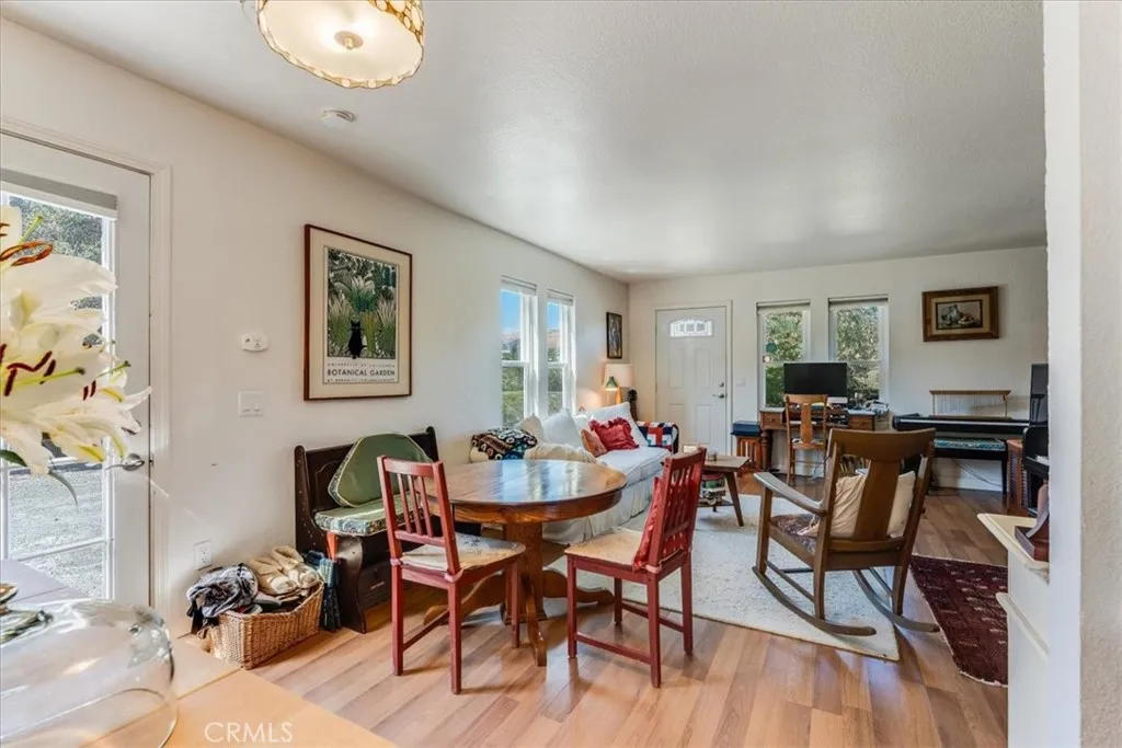 Dining area and view of front and back doors.