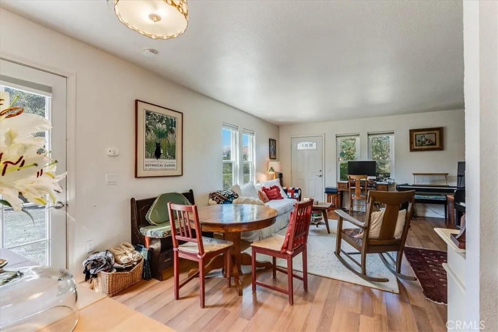 Dining area and view of front and back doors.