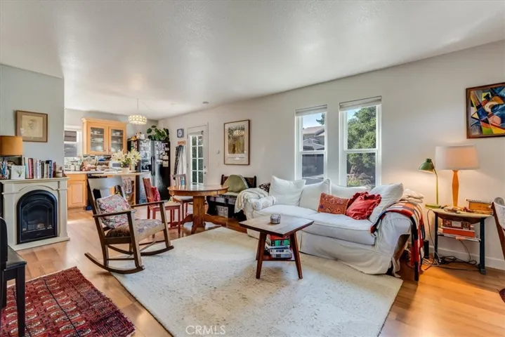 View of living room, dining area and kitchen.