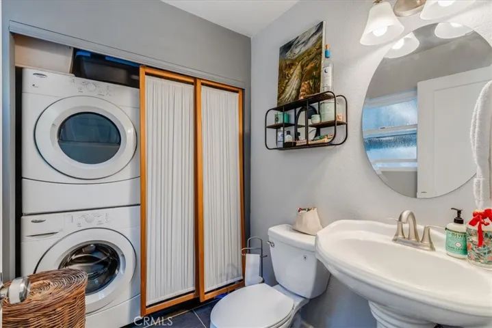 Downstairs powder room has washer and dryer.