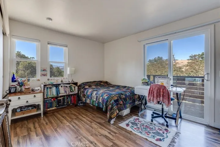 Bedroom with balcony views.