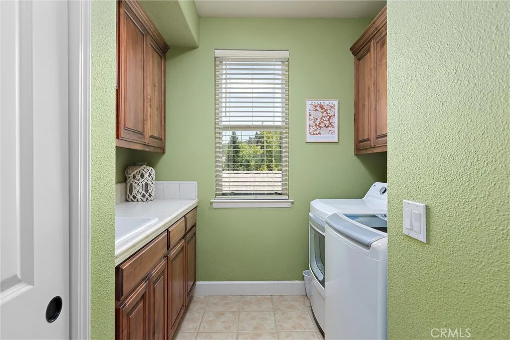 The upstairs laundry room has storage galore.