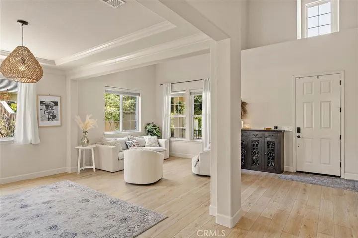 As you enter the home you will fall in love with the light vinyl plank flooring that flows throughout the downstairs and the open floorplan with high ceilings.