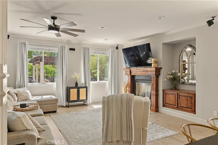 The light & bright family rooms looks out to the backyard oasis!