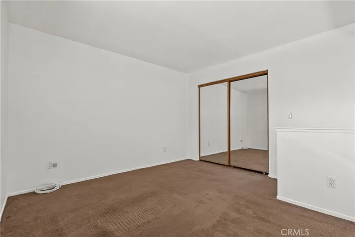 Mirrored wardrobe closet in loft, could be a 2nd bedroom