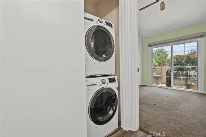 Laundry outside of primary bedroom