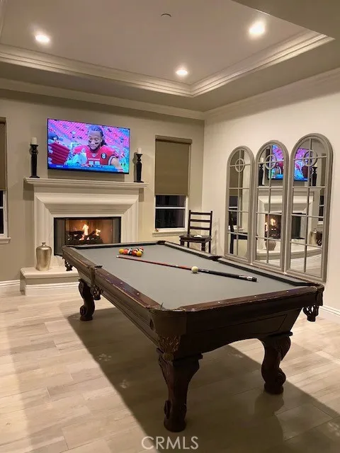 Pool table area with fireplace, TV