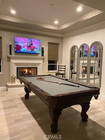 Pool table area with fireplace, TV