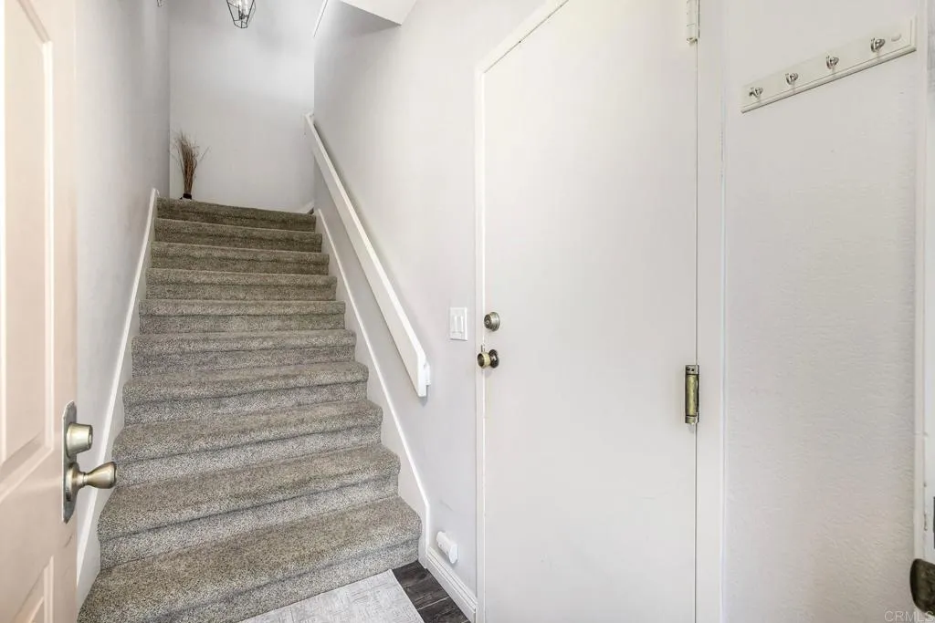 Staircase leads from your living space to your attached 1-car garage~
