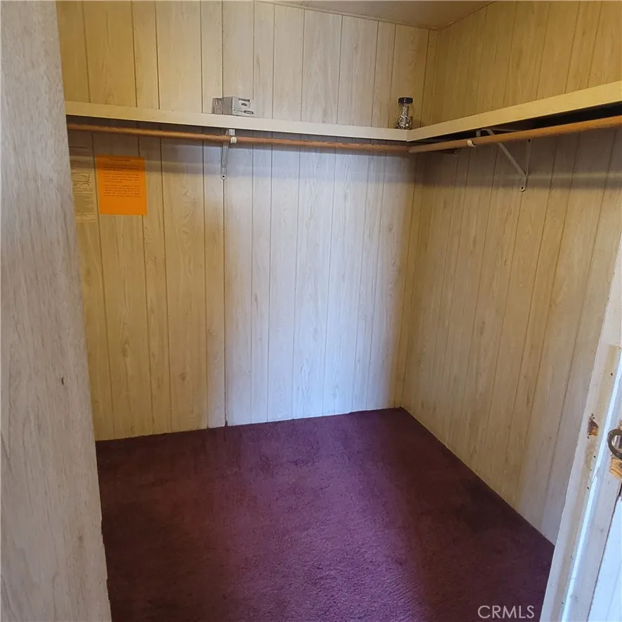 Primary bedroom walk in closet