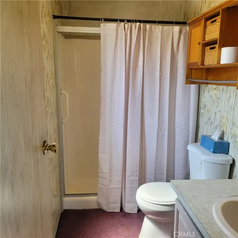 Primary bedroom bathroom with walk in shower