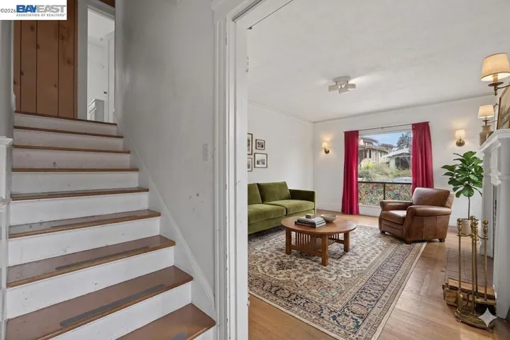 Virtually Staged Stairs to upstairs and living room
