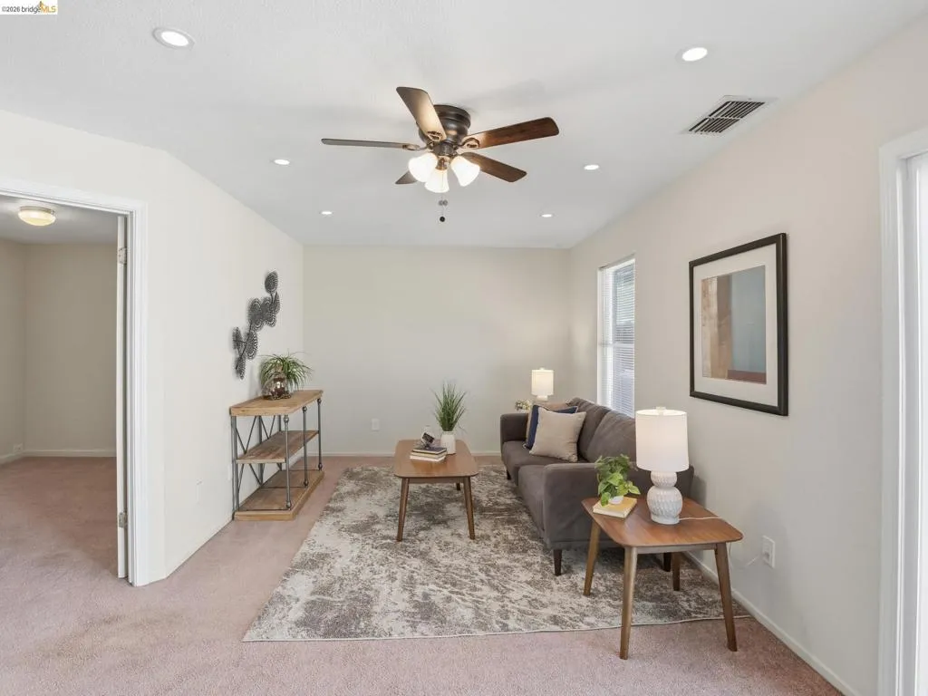 Inviting living space featuring carpet flooring and light-toned walls