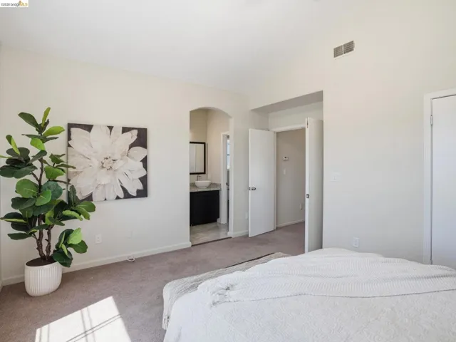 Spacious room with vaulted ceilings and neutral wall tones