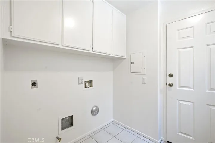 Laundry/utility area with practical storage and workspace.