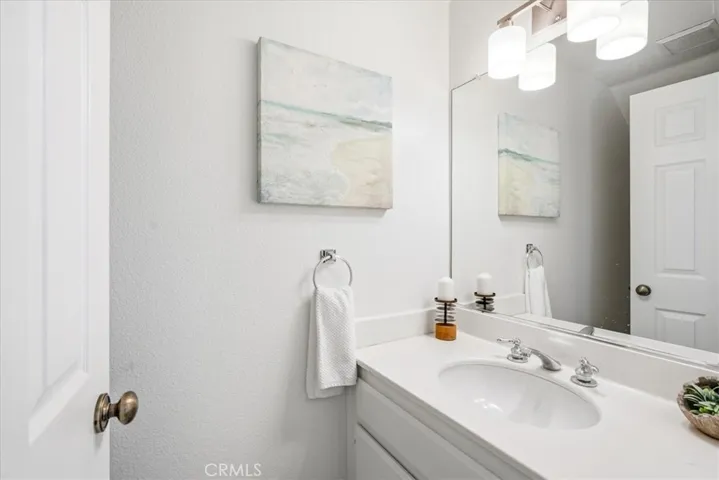 Bathroom with modern fixtures and bright finishes.