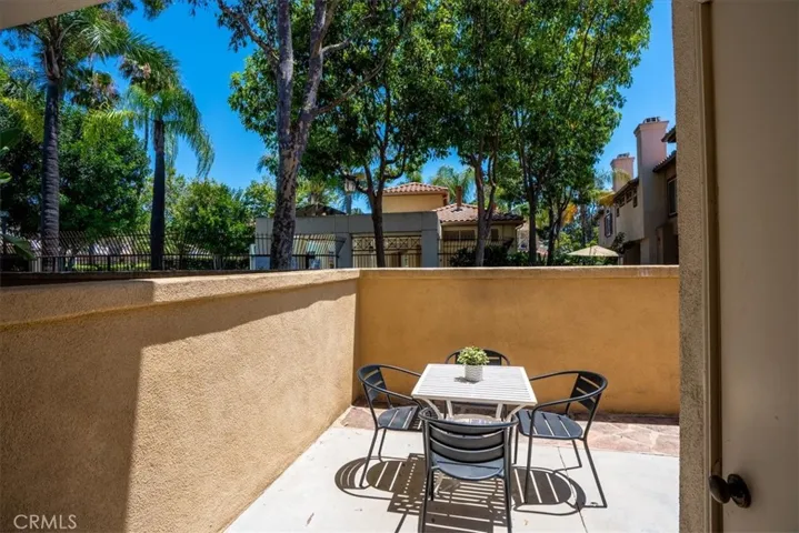 Private patio seating area with outdoor dining space and natural surroundings.