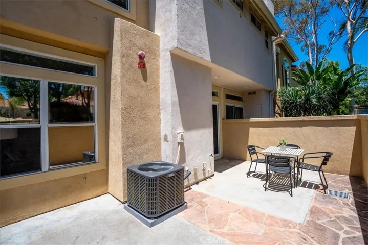 Ground-level patio with direct access and space for outdoor lounging.